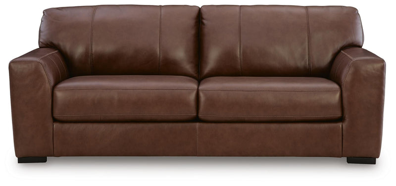 Ashley Furniture Brogliano living room set with a sofa and armchair featuring beige upholstery and wooden legs.