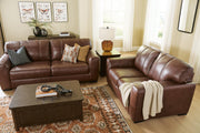 Ashley Furniture Brogliano living room set including a sofa and armchair with neutral fabric upholstery and modern design.