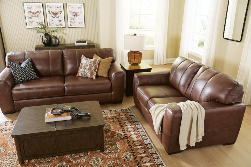 Ashley Furniture Brogliano living room set including a sofa and armchair with neutral fabric upholstery and modern design.