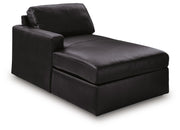 Ashley Furniture Modmax II sectional sofa with chaise, showing a stylish, modern living room setup from an angled view.