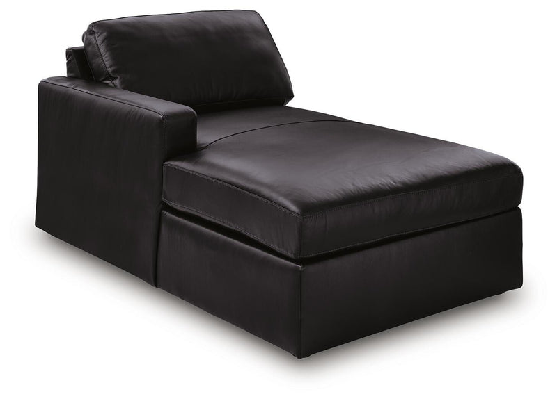 Ashley Furniture Modmax II sectional with chaise and storage consoles, shown from an angled view in a modern living room setting.