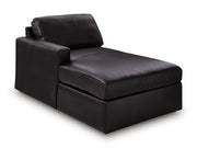 Ashley Furniture Modmax II sectional with chaise and integrated audio consoles, shown from an angled view in a modern living room setting.
