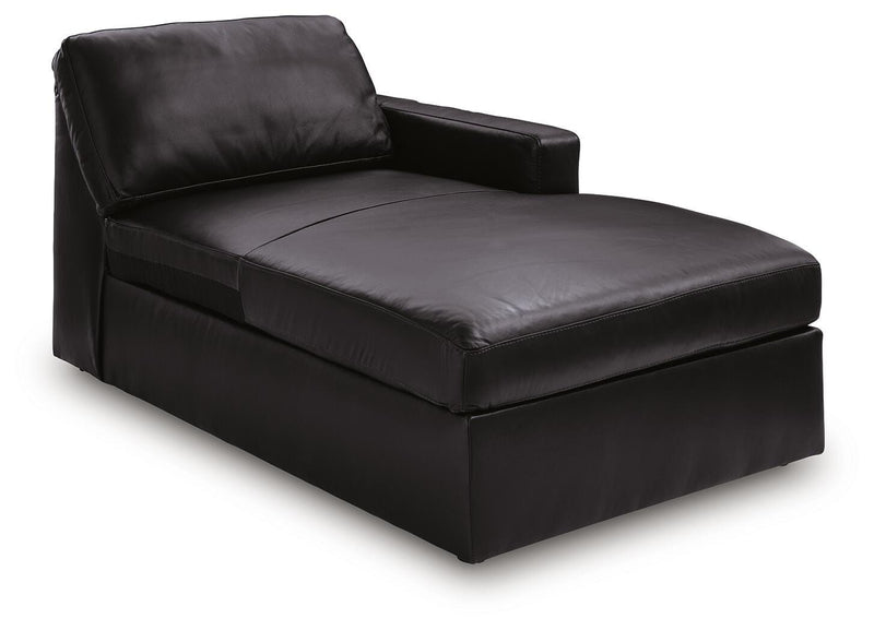 Ashley Furniture Modmax II sectional with chaise and built-in audio consoles, shown from an angled view highlighting its modern design.