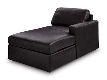 Ashley Furniture Modmax II sectional with chaise and audio consoles, shown from an angled view highlighting the seating and built-in features.