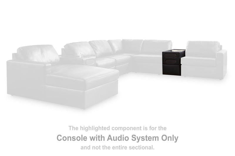 Ashley Furniture Modmax II sectional with chaise and built-in audio consoles, featuring plush cushions and modern design.