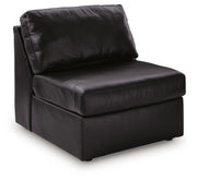 Ashley Furniture Modmax II sectional sofa shown from an angle, featuring plush cushions and modern design in a spacious living room setup.