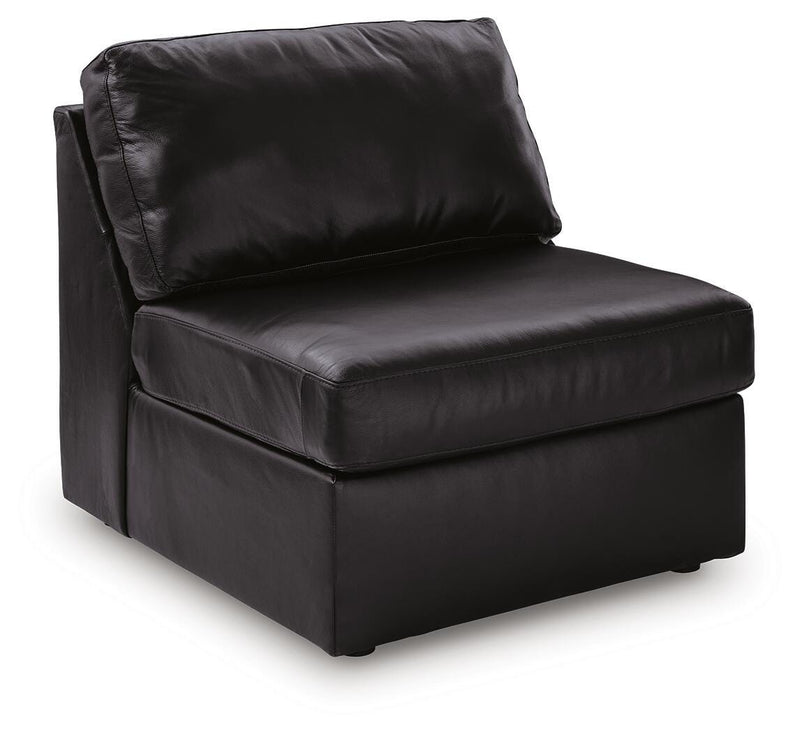 Ashley Furniture Modmax II sectional sofa with chaise, featuring plush cushions and a modern design, shown from an angled side view.
