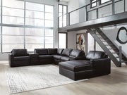 Ashley Furniture Modmax II sectional with chaise and audio consoles, showcasing plush upholstery and modern design.