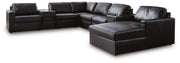 Ashley Furniture Modmax II sectional with chaise and audio consoles, featuring plush upholstery and modern design.