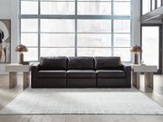 Ashley Furniture Modmax II sectional sofa with plush cushions and modern design, shown in a cozy living room setting.