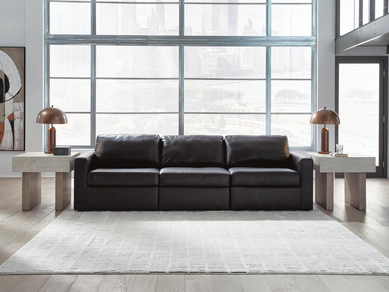 Ashley Furniture Modmax II sectional sofa with plush cushions and modern design, shown in a cozy living room setting.