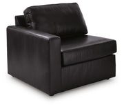 Ashley Furniture Modmax II sectional sofa shown from an angled view, featuring modern design and plush seating in a spacious living room.