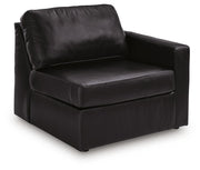 Ashley Furniture Modmax II sectional with chaise and storage consoles, angled view showing upholstery and built-in storage features.