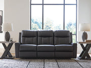 Ashley Furniture Mackmenville living room set featuring a sofa, loveseat, and armchair with neutral fabric upholstery.