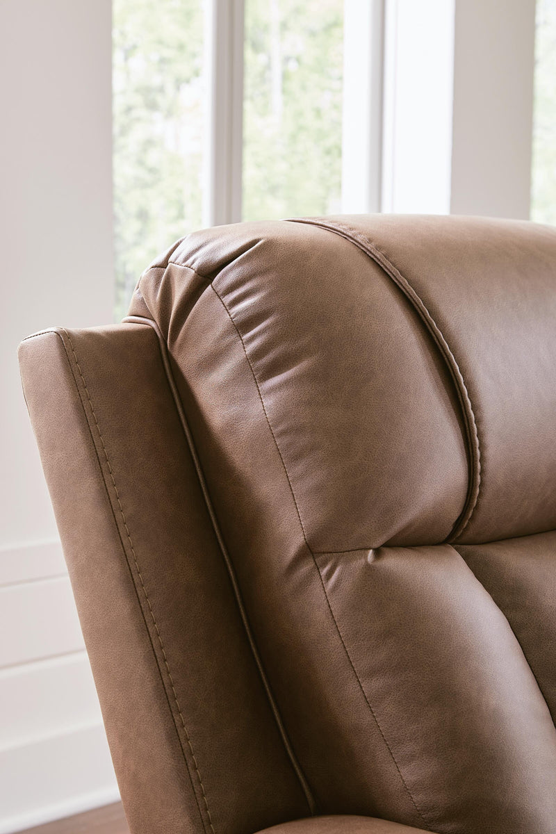 Ashley Furniture Mackmenville reclining loveseat with console, showing plush fabric, padded armrests, and built-in center console.