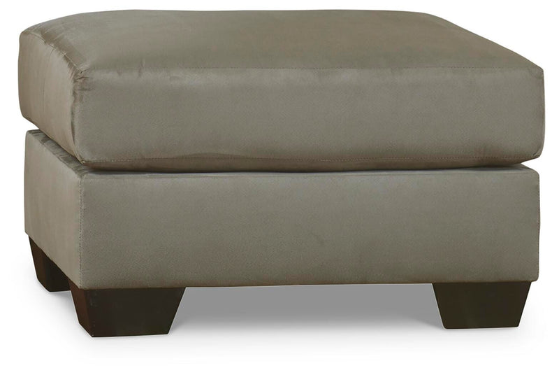 Ashley Furniture Darcy living room set with sofa and armchair in a modern design, shown in a cozy home setting.