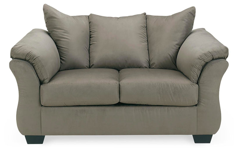 Ashley Furniture Darcy loveseat in beige fabric with plush cushions and wooden legs, perfect for cozy living room seating.