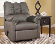 Ashley Furniture Darcy Recliner with plush fabric and padded armrests, shown in a cozy, modern living room setting.