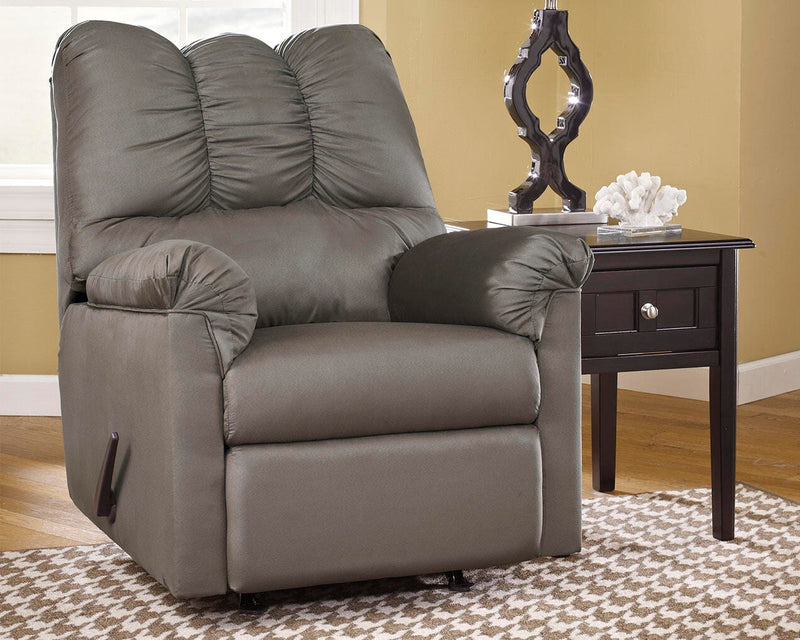 Ashley Furniture Darcy Recliner with plush fabric and padded armrests, shown in a cozy, modern living room setting.