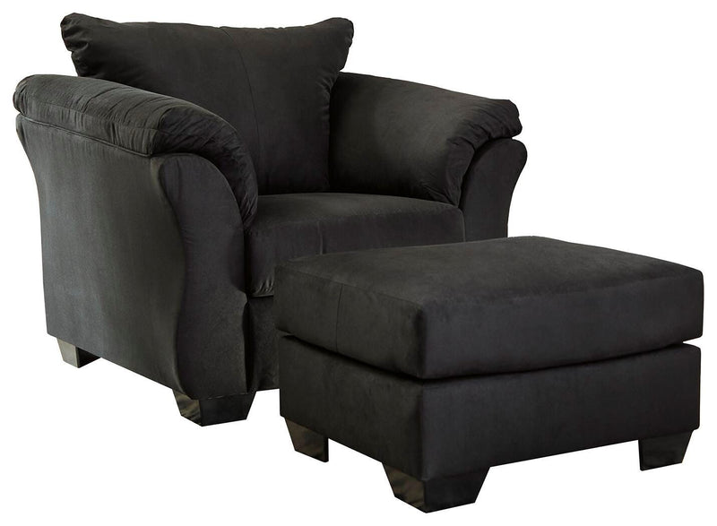 Ashley Furniture Darcy living room set with sofa and loveseat, featuring plush cushions and dark wood legs in a stylish living space.