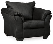Ashley Furniture Darcy living room set featuring a sofa and loveseat with neutral upholstery and wooden legs.