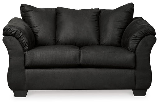 Ashley Furniture Darcy loveseat with plush fabric and cushioned seats, shown in a cozy living room setting.