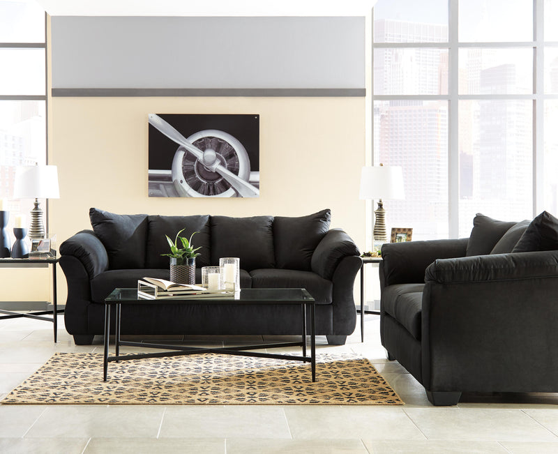 Ashley Furniture Darcy living room set includes a sofa and loveseat with neutral fabric upholstery and modern design.