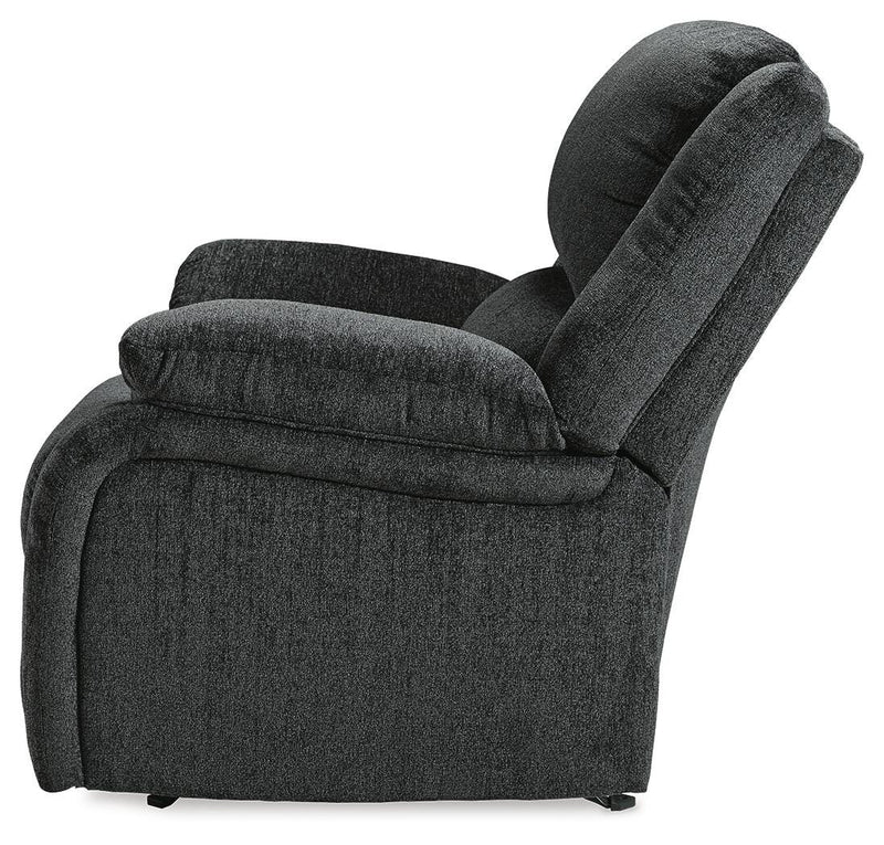 Ashley Furniture Draycoll recliner shown from the side, featuring plush cushioning and a contemporary design.