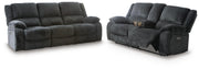 Ashley Furniture Draycoll living room set featuring a plush sofa and matching armchair in a modern design.