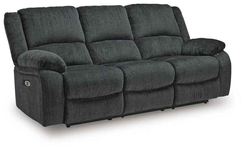 Ashley Furniture Draycoll living room set with sofa and armchair, shown from an angled view in a modern living space.