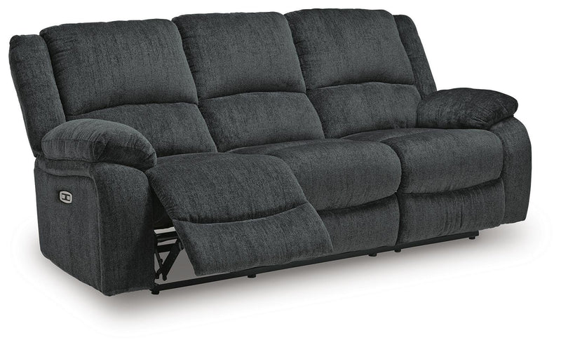 Ashley Furniture Draycoll power reclining sofa shown in an open angle, featuring plush cushions and a modern design.