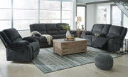 Ashley Furniture Draycoll living room set featuring a sofa and armchair with neutral upholstery and wooden legs.
