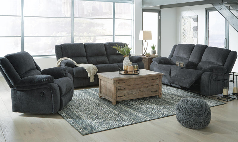 Ashley Furniture Draycoll living room set featuring a sofa and armchair with neutral upholstery and wooden legs.