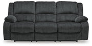 Ashley Furniture Draycoll power reclining sofa with plush cushions and reclining features, shown from a head-on view.