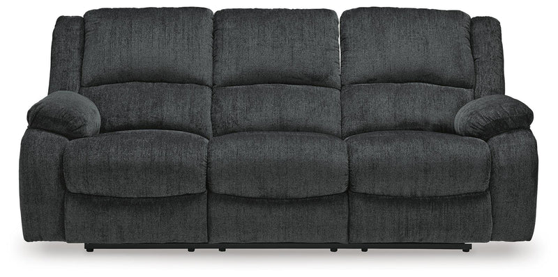 Ashley Furniture Draycoll power reclining sofa with plush cushions and reclining features, shown from a head-on view.
