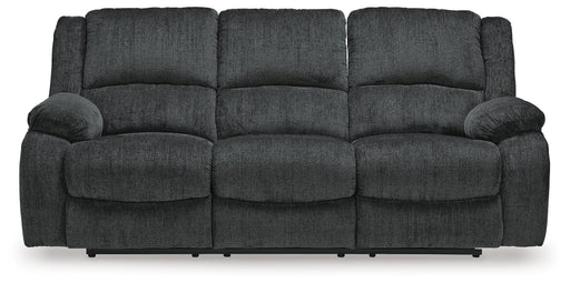 Ashley Furniture Draycoll reclining sofa with plush cushions, wide armrests, and a neutral fabric finish, shown from a front head-on view.