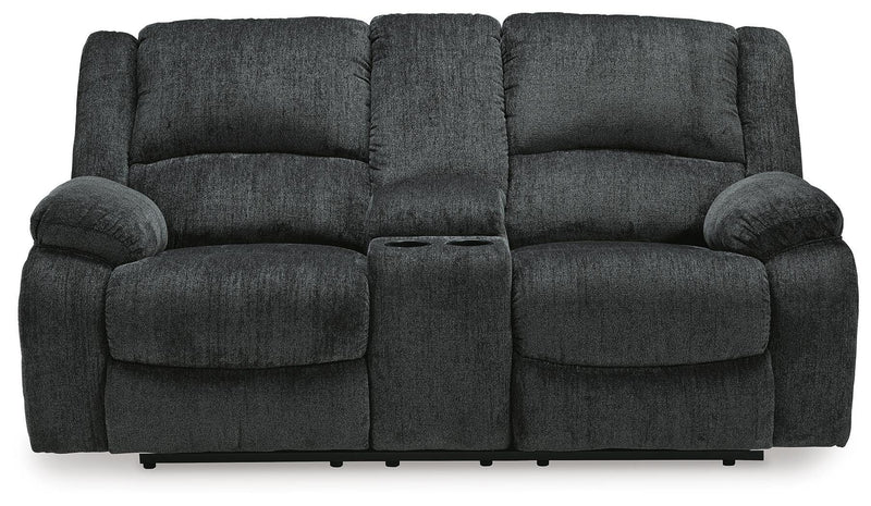 Ashley Furniture Draycoll reclining loveseat with console, shown from head-on view, featuring plush fabric and built-in cup holders.
