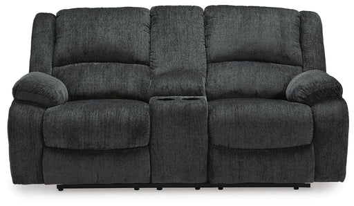 Ashley Furniture Draycoll reclining loveseat with console, shown from head-on view, featuring plush fabric and built-in cup holders.
