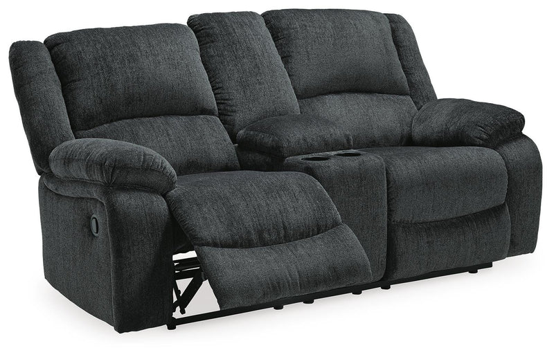 Open-angle view of Ashley Furniture Draycoll reclining loveseat with built-in console, fabric upholstery, and plush cushioning.