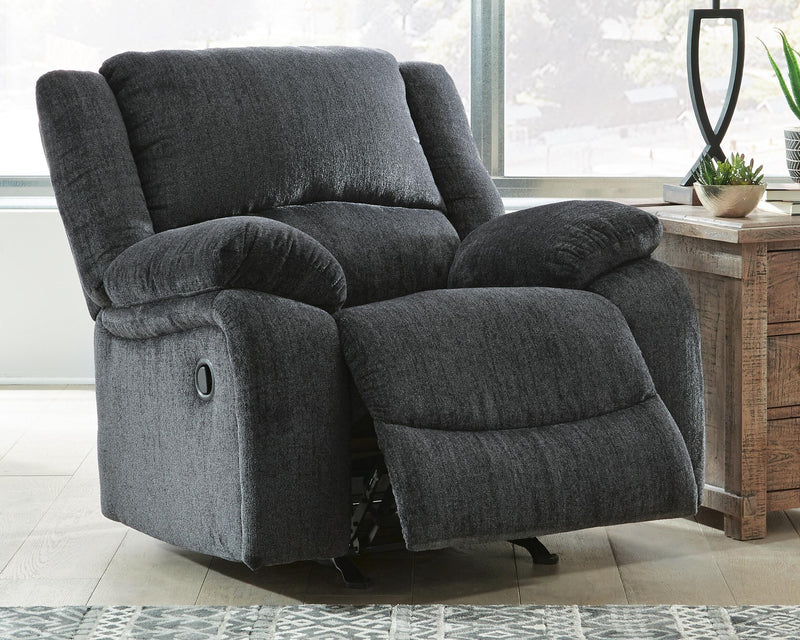 Open Ashley Furniture Draycoll recliner showing plush fabric upholstery and reclining mechanism, designed for comfortable seating.