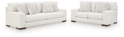 Ashley Furniture Hartside living room set with sofa and armchair in a modern design, shown in a cozy, stylish living room.