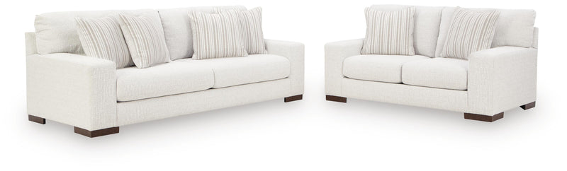 Ashley Furniture Hartside living room set with sofa and armchair in a modern design, shown in a cozy, stylish living room.