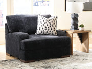 Ashley Furniture Whitmore Manor oversized chair with plush fabric and wide armrests, perfect for a living room or lounge space.