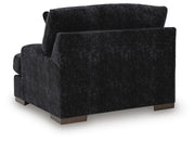 Ashley Furniture Whitmore Manor oversized chair with plush fabric and wide armrests, viewed from the back.