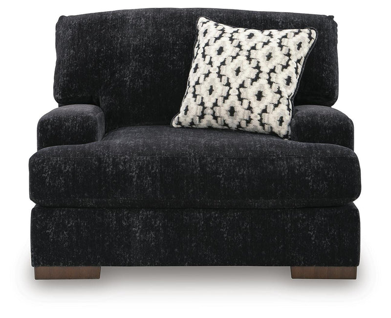 Ashley Furniture Whitmore Manor oversized chair with plush upholstery and cushioned armrests, shown from a front head-on view.