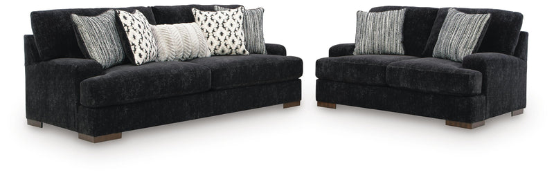 Ashley Furniture Whitmore Manor living room set with sofa and armchair in a cozy, stylish living space.