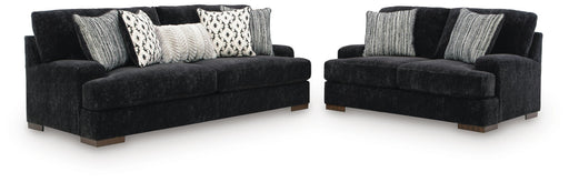Ashley Furniture Whitmore Manor living room set with sofa and armchair in a cozy, stylish living space.