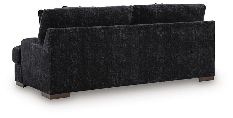 Ashley Furniture Whitmore Manor sofa with plush fabric and classic design, shown from the back angle.