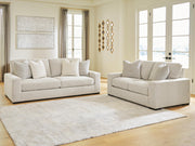Ashley Furniture Conlee-Pike living room set with a sofa and armchair in a modern design, featuring neutral upholstery and wooden accents.