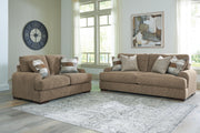 Ashley Furniture Jayne Park living room set with sofa and loveseat featuring neutral fabric upholstery and modern design.